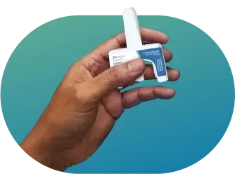Hand Holding ZAVZPRET™ (zavegepant) Nasal Spray